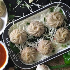 A picture of Steamed Paneer Tikka Momos.
