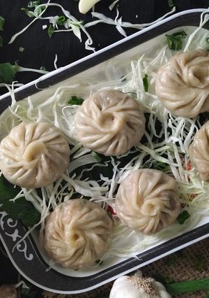 A picture of Steamed Paneer Tikka Momos.