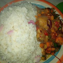 A picture of White rice with sauce.