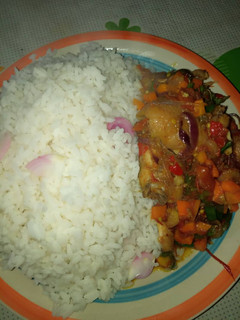 A picture of White rice with sauce.