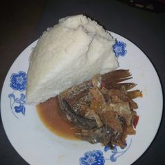 A picture of Stewed fish with ugali.