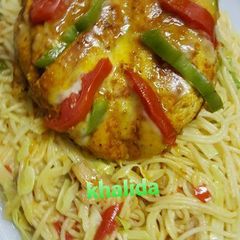 3 spices cheese and veggies stuffed chicken with veg spaghetti A picture of 3 spices cheese and veggies stuffed chicken with veg spaghetti.