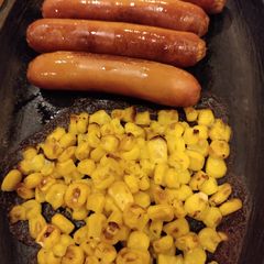 A picture of Oven Cooked Sausage and Corn.