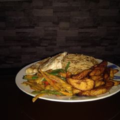 A picture of Omelette, pasta, veggies and fried plantain.