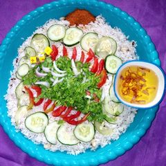 A picture of Rice and beans with salad.