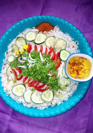 A picture of Rice and beans with salad.