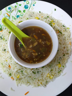 A picture of Chinese fried rice and manchow soup.