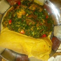 A picture of Moimoi and vegetable sauce.