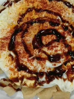 Una foto de Huevos fritos con calamares rebozados