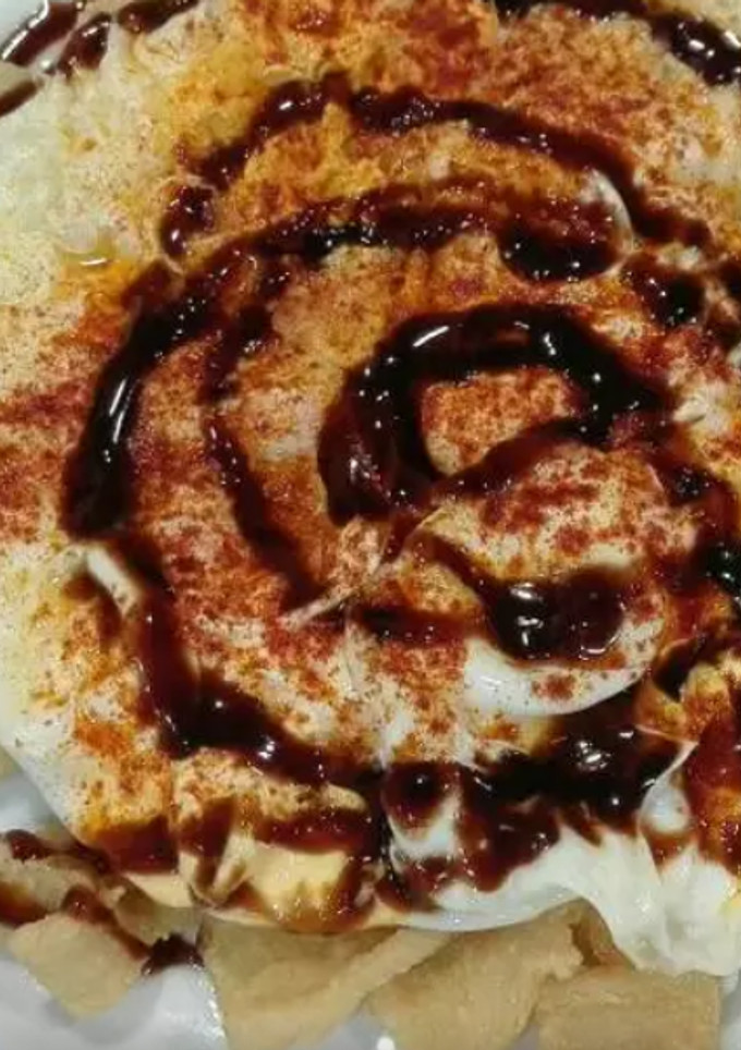 Una foto de Huevos fritos con calamares rebozados