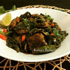 A picture of Spinach Stir Fry with Fish Egg Fritters.