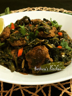A picture of Spinach Stir Fry with Fish Egg Fritters.