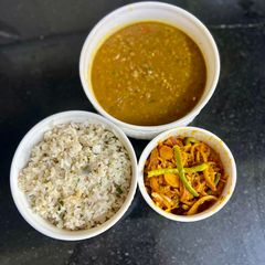A picture of Horse Gram Daal With Brown Jeera Rice & Spicy Onion 🧅 Pickle.
