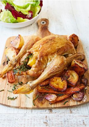 A picture of Roast Chicken with Potatoes & Carrots.