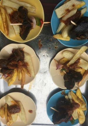 A picture of Fried yam and potatoes with snail.