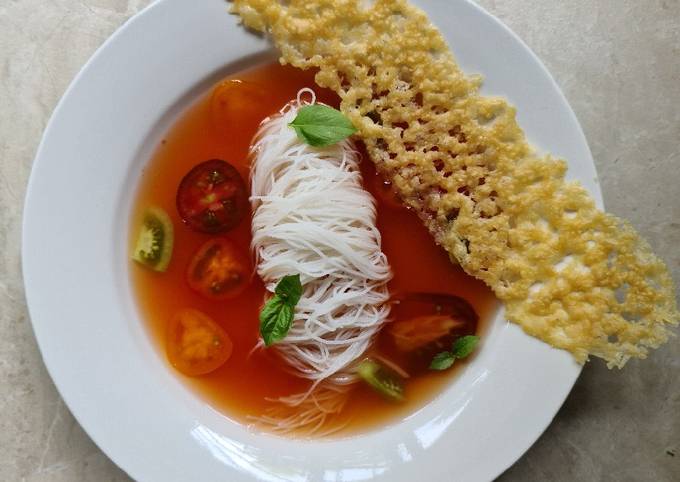 Tomato broth with vermicelli noodles and parmesan crisp