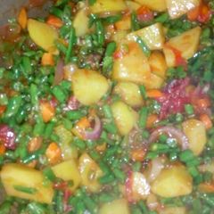 A picture of Green veggies with rice,.