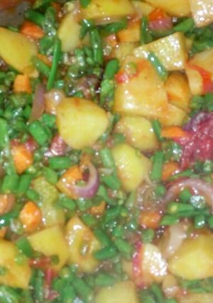 A picture of Green veggies with rice,.