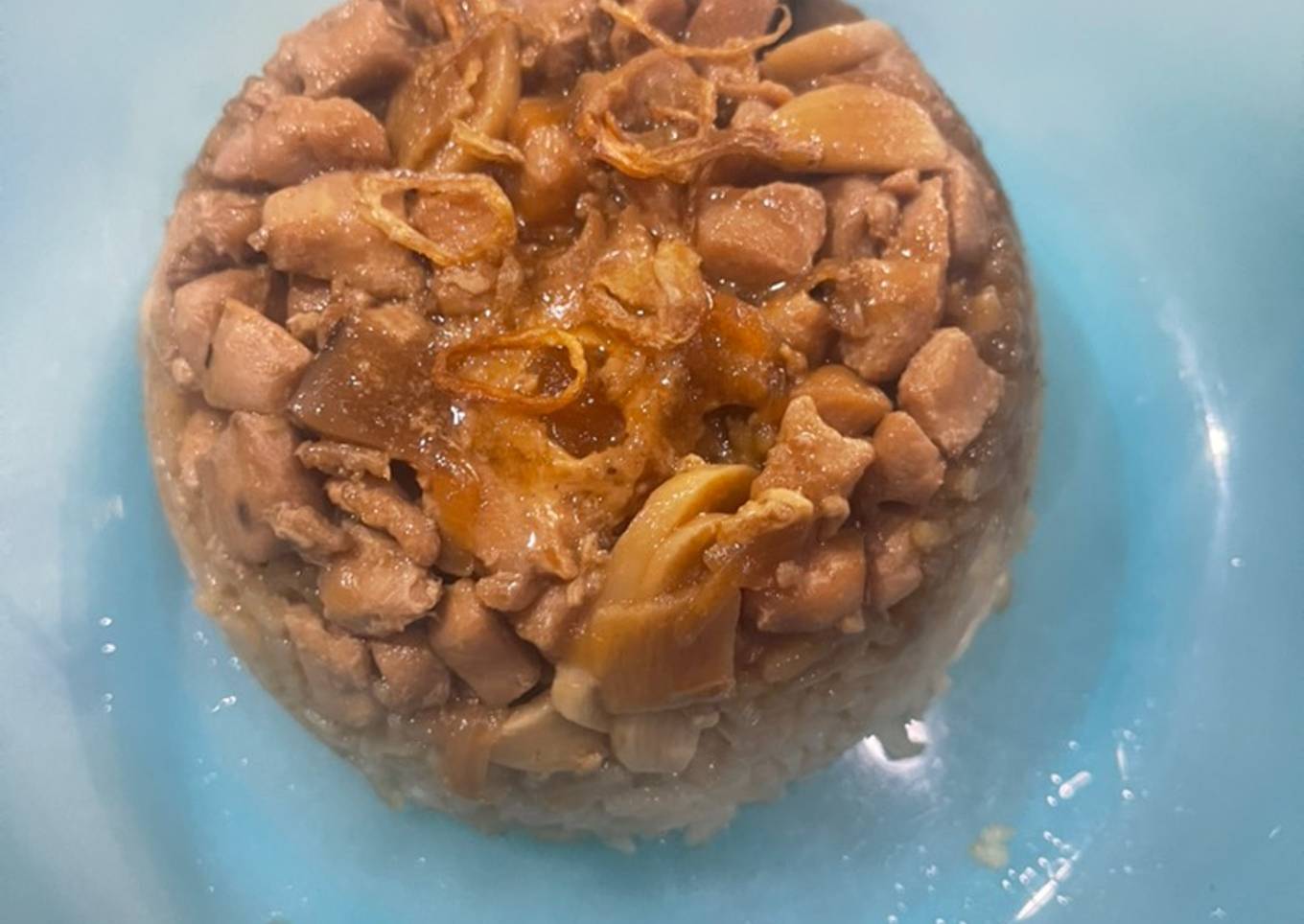 Nasi tim ayam hioko dengan telur asin