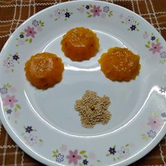 A picture of Custard powder halwa with roasted sesame seeds.