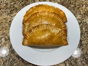 A picture of baked empanadas