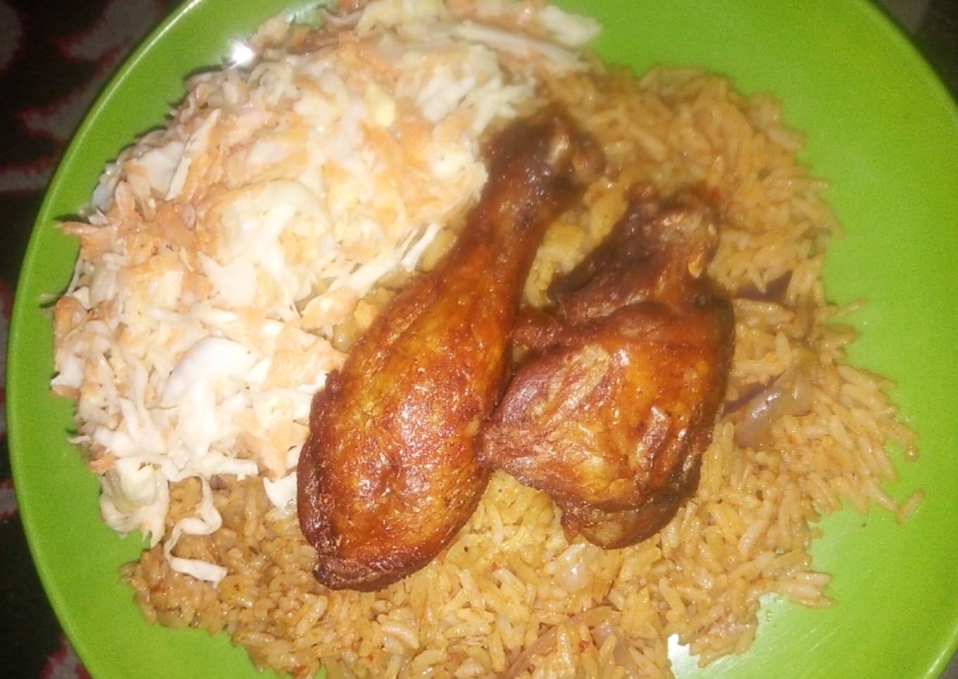 Jollof Rice, coslow and fried chicken