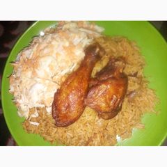 A picture of Jollof Rice, coslow and fried chicken.