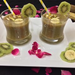 A picture of Banana kiwi Smoothie with orange juice.
