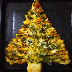 A picture of Stuffed spinach and cheese Xmas bread.