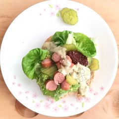 A picture of Avocado And Sausage With Tartar Sauce Pita Sandwich.