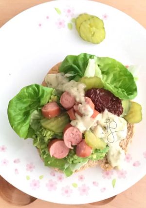 A picture of Avocado And Sausage With Tartar Sauce Pita Sandwich.