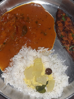 A picture of Fish thali - Rice with Fish curry, fish fry, and spiced buttermilk.