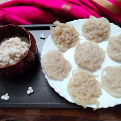 A picture of Sabudana Idiyappam with sweet coconut chutney.