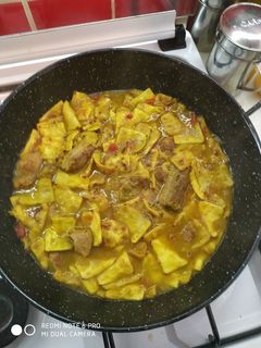 Una foto de Gazpachos manchegos con costillas y magro de cerdo