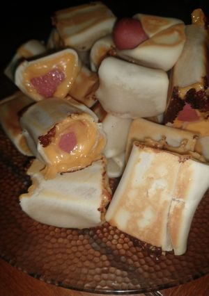 Una foto de Salchichas con cheddar envueltas