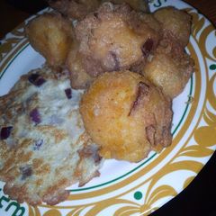 A picture of Potato balls with egg inside.