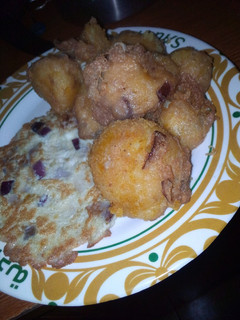 A picture of Potato balls with egg inside.