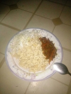 A picture of Macaroni paster serve with vegetables source nd cabbage.