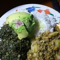 A picture of Plain rice, greengrams and kales.