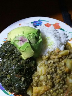 A picture of Plain rice, greengrams and kales.