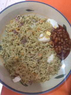 A picture of Noodles and baked Beans.