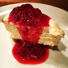 A picture of Simple White Chocolate Cheesecake with Raspberry Sauce.