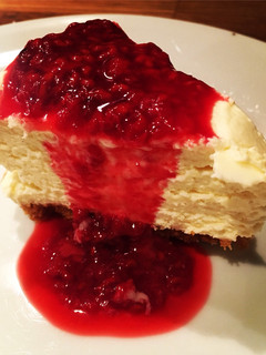 A picture of Simple White Chocolate Cheesecake with Raspberry Sauce.
