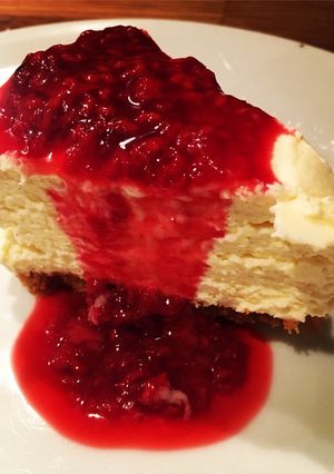 A picture of Simple White Chocolate Cheesecake with Raspberry Sauce.