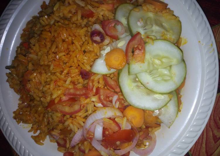 Step-by-Step Guide to Make Homemade Jollof rice with caron cucumber onio frest tomatos dry fish