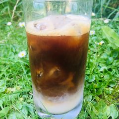 A picture of My perfect iced coffee with coconut milk 🌴 🥥 ☕️☀️🌱.