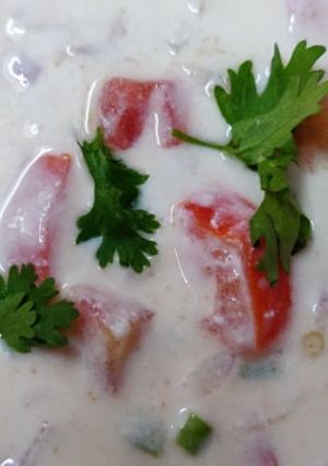 A picture of Tomato Raita Recipe | How to make Tomato Raita | Thakkali Thayir Pachadi.