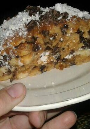 Una foto de Arrollado de banana y chocolate😊