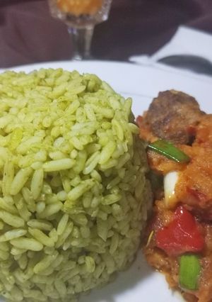 A picture of Green rice and Caropina sauce.