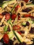 Penne pasta salad with zucchini and olives